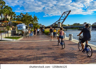 Tampa Bay, Florida. March 02, 2019. People Biking And Walking At Riverwalk In Downtown Area  (2)