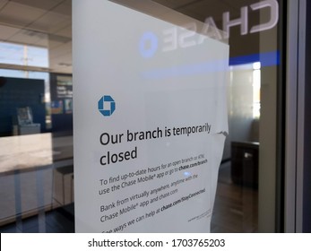 Tampa, FL - 4/1/2020: A Chase bank (NYSE:JPM) branch is closed due to the covid-19 pandemic. A notice says customers can still access safety deposit boxes and use the ATM for banking. 