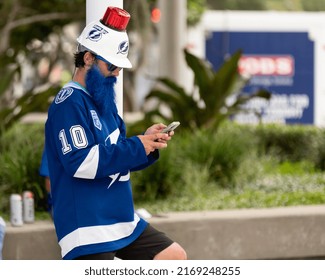 Tampa, FL - USA - June 18, 2022: Tampa Bay Lighting Fan With A Blue Beard And Hard Hat Outside Amalie Arena Before Game 2 Against The Colorado Avalanche