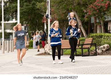 Tampa, FL - USA - June 18, 2022: Tampa Bay Lighting Fans With Girl On Her Mother's Shoulders Outside Amalie Arena Before Game 2 Against The Colorado Avalanche