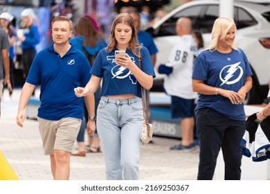 Tampa, FL - USA - June 18, 2022: Tampa Bay Lighting Fan Looking At Her IPhone Outside Amalie Arena Before Game 2 Against The Colorado Avalanche