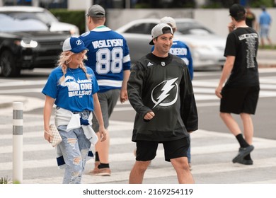 Tampa, FL - USA - June 18, 2022: Tampa Bay Lighting Fans Crossing The Street Near Amalie Arena Before Game 2 Against The Colorado Avalanche