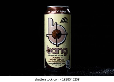 Tampa, FL USA - March 3, 2021: Cookies and Cream Craze high protein ketogenic Bang energy drink with cold condensation in black background