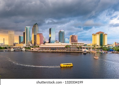 Tampa, Florida, USA Downtown Skyline On The Bay At Dusk With Water Traffic.