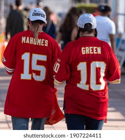 Tampa, Florida  USA - January 31, 2021: Two Kansas City Chiefs Fans Wearing American Football Jerseys,  Walking to the Super Bowl LV Experience in Downtown Tampa Florida.