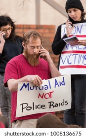 Tampa, Florida / USA - January 6, 2018: Male Protester Calling City Council Members At The Tampa City Council's Bathhouse Ordinance Protest Outside City Hall