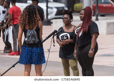 Tampa, Florida / USA - June 14, 2020: Two African American Women Being Interviewed At The National Pan Hellenic Council (NPHC) Sign At The Black Lives Matter Peaceful Protest In Tampa, Florida.