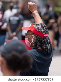 Tampa, Florida / USA - June 14, 2020: Delta Sigma Theta Sorority Member With Her Fist Raised At The National Pan Hellenic Council (NPHC) At The Black Lives Matter Peaceful Protest In Tampa, Florida.