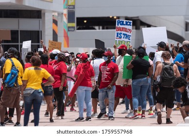 Tampa, Florida / USA - June 14, 2020: Protestor Holding In A Crowd 