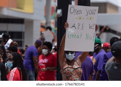 Tampa, Florida / USA - June 14, 2020: Woman In A Face Mask Holding A Sign At The National Pan Hellenic Council (NPHC) Black Lives Matter Peaceful Protest In Tampa, Florida.