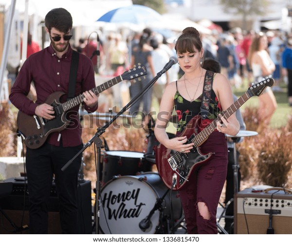 Tampa, Florida / USA - March 2, 2019: Lead Singer and\
Guitarist for the Band Future Soul Performing Outdoors at an Art\
Festival in Tampa, FL.