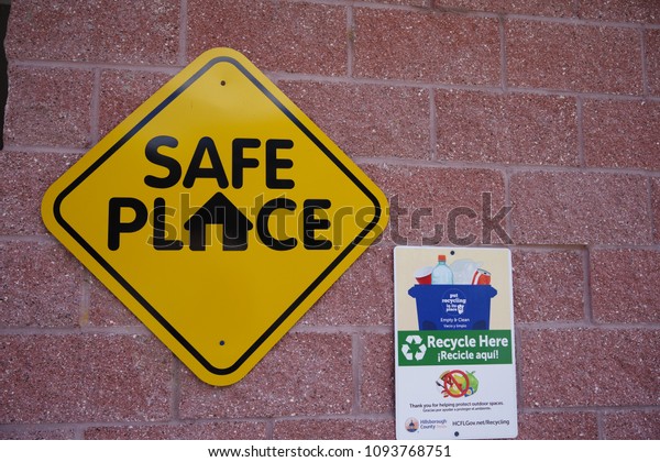 Tampa, Florida / USA - May 5 2018: \
Recycle Here and Safe Place Public County\
Signage