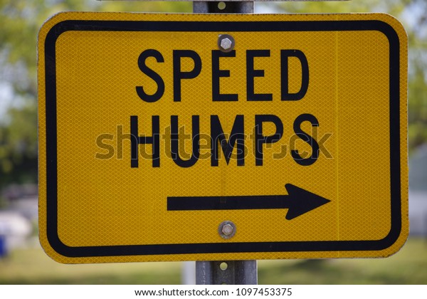 Tampa, Florida / USA - May 5 2018: SPEED HUMPS and\
Public Road Sign