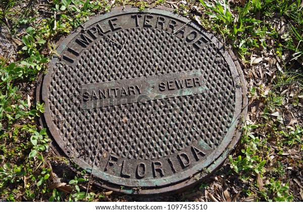 Tampa, Florida / USA - May 5 2018: Temple\
Terrace Sanitary Sewer County Man\
Hole