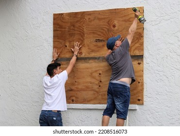 Tampa, Florida, USA - September 27, 2022: Residents Board Up Windows In Preparation For Hurricane Ian