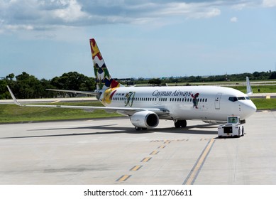 Tampa International Airport Florida USA. 2018. A Cayman Airways Being Pushed Back From The Stand.