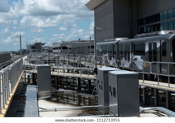 Tampa\
International Airport, Florida, USA. 2018. The skyconnect train\
between terminal, parking and rental car\
building.
