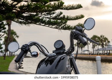 TAMPA, UNITED STATES - Jun 21, 2021: Harley Davidson 883 Sportster Waterside Sunset