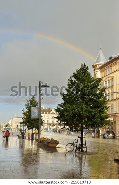 TAMPERE, FINLAND - AUGUST 28, 2014:Heavy rain and\
sun on streets. Tampere is most populous inland city in any of\
Nordic countries.It was founded as market place on banks of\
Tammerkoski channel in\
1775