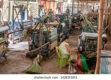 TAN CHAU, VIETNAM  - FEBRUARY 16, 2019:  Vietnamese Woman Making Rattan Carpet.