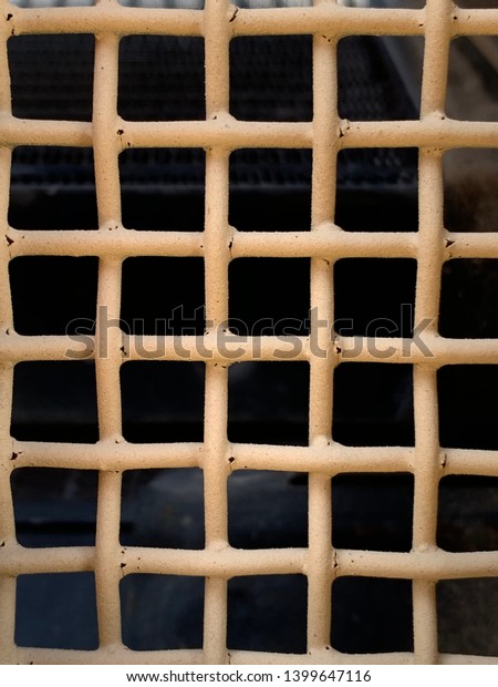 Tan metal grate of the hood from a military\
vehicle texture and pattern