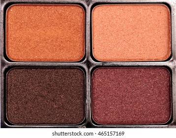 Tan, Orange, Purple, Lilac And Brown Eye Shadow Powder In A Makeup Case