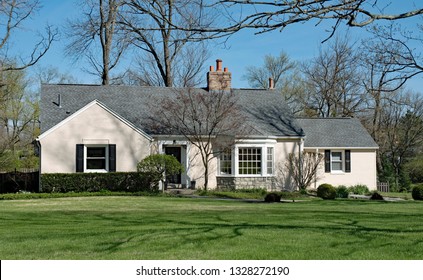 Tan Painted Brick House With Bay Window