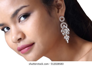 Tan Skin Model Girl With Diamond Earring In Shape Of Grape And Tear Drop On Leaf Side Of Face, Concept Of Present Earring