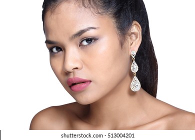 Tan Skin Model Girl With Diamond Earring In Shape Of Grape And Tear Drop On Leaf Side Of Face, Concept Of Present Earring