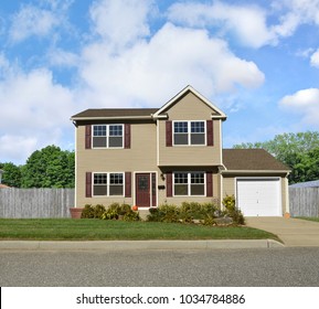 Tan Suburban McMansion Home Blue Sky Clouds USA