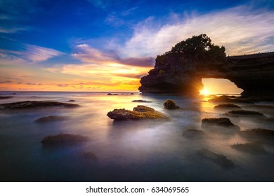 Tanah Lot Temple At Sunset In Bali, Indonesia.(Dark) Seascape View.