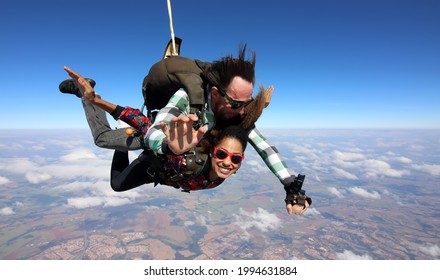 Tandem Parachute Jump. Beautiful Brazilian Woman.