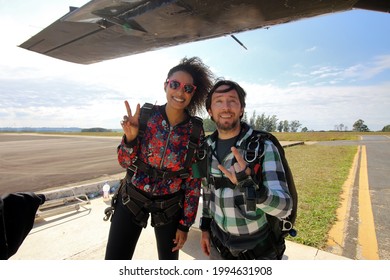 Tandem Parachute Jump. Beautiful Brazilian Woman.