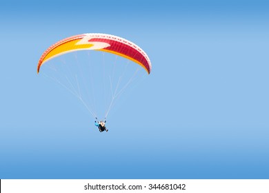 Tandem Paraglider Free Gliding At High Altitude In Deep Blue Sky