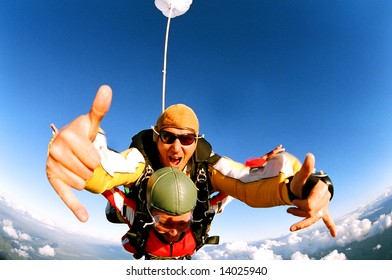 Tandem skydiver in action parachuting.