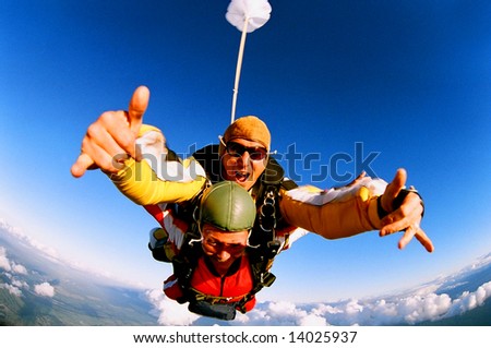 Tandem skydiver in action parachuting.