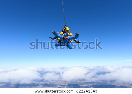 Tandem skydiving. Above the Earth.
