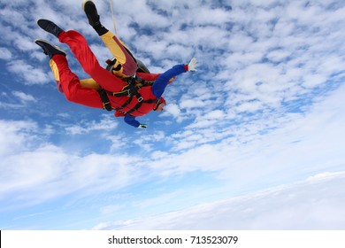 Tandem skydiving. Tandem is flying in the sky.