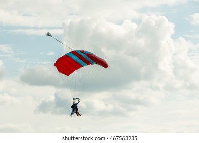 Tandem skydiving on a large parachute. Preparing for landing.