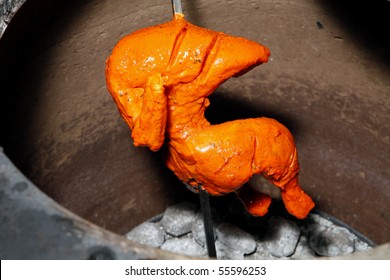 Tandoori Chicken Being Cooked In Clay Oven