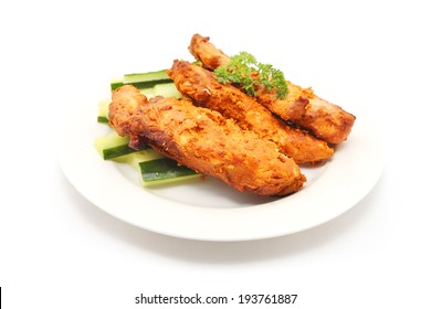 Tandoori chicken isolated on white
