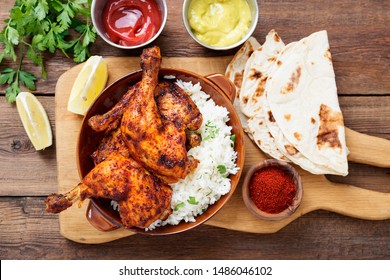  Tandoori chicken with jasmine rice and pita bread, indian cuisine.