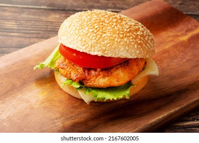 Tandoori chicken, lettuce and tomato sandwich burger