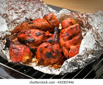 Tandoori chicken on aluminium foil