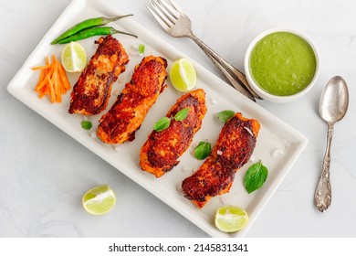 Tandoori Fish, Fish Tikka With Green Chutney, Lemon Nad Fresh Mint, Top Down Indian Food Photo