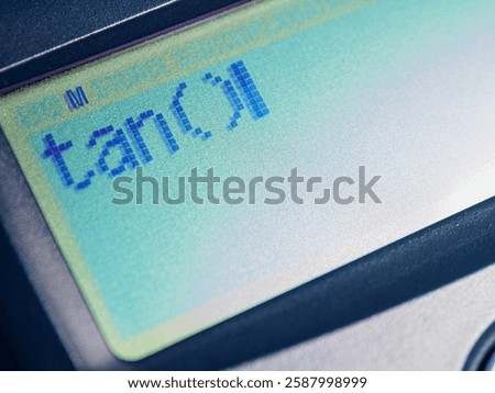 Tangent – trigonometry function displayed on the calculator screen, close-up.