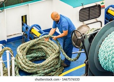 Tanger Med, Morocco - October 22, 2013. Worker Of The Ferry Boat Preparing The Rope Of Boat