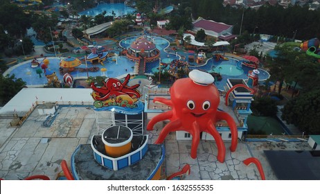 Tangerang, Indonesia - 12/01/2020
Aerial Video Drone Of Ocean Waterpark Amusement Park In BSD City Tangerang. Giant Octopus Statue, Giant Swimming Pool, Pirate