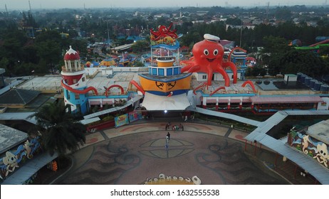 Tangerang, Indonesia - 12/01/2020
Aerial Video Drone Of Ocean Waterpark Amusement Park In BSD City Tangerang. Giant Octopus Statue, Giant Swimming Pool, Pirate