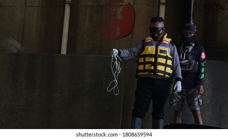 Tangerang / Indonesia -4 September 2020 - Covid-19 Task Force Officers Together With Environmental Activists Found Medical Waste Suspected To Be COvid-19 Waste In The Cisadane River